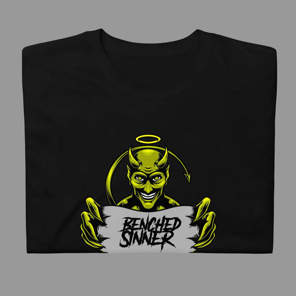 Black short-sleeve unisex Logo Tee featuring a green devil character holding a sign that reads "Benched Sinner"